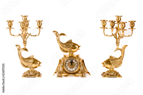 Vintage gold watch with candelabra on white background