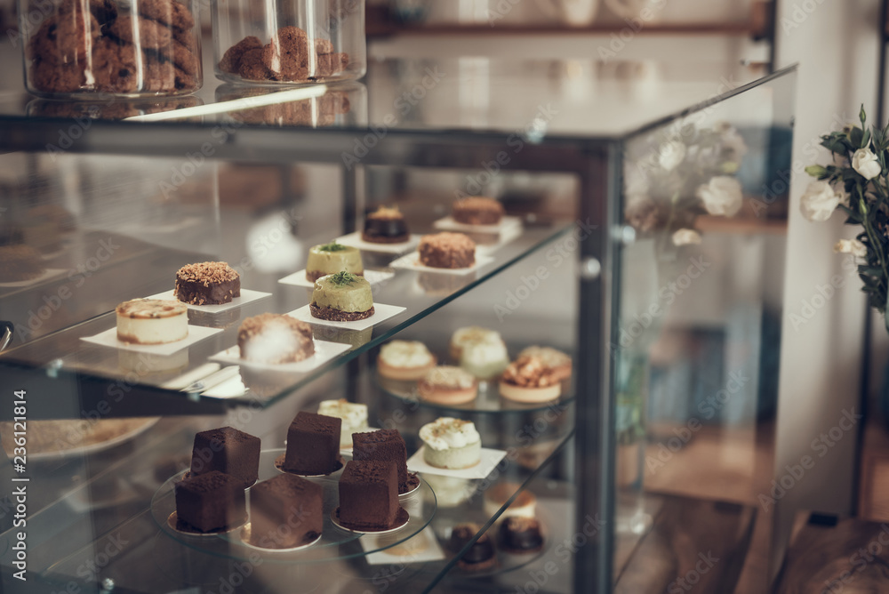 laconic image of lovely cupcakes places in the glass case in cafe