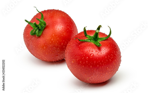 Tomatoes isolated on white background. Two fresh raw vegetables