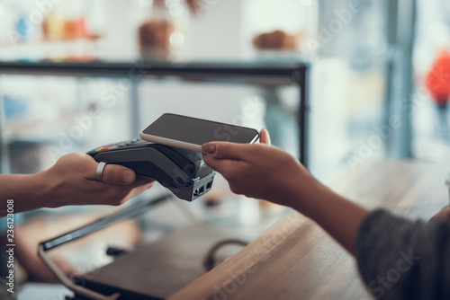 Cropped photo of contactless payment with smartphone