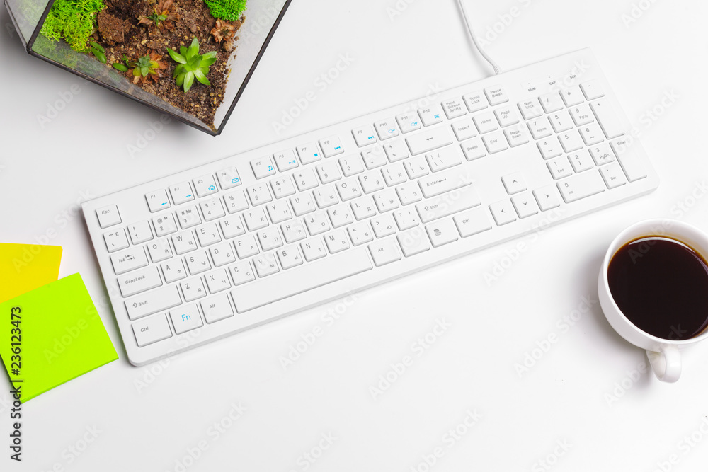 Modern white office desk table with computer keyboard and supplies. Top view with copy space, flat lay. Modern white office desk table with computer keyboard and supplies. Top view with copy space, flat lay.