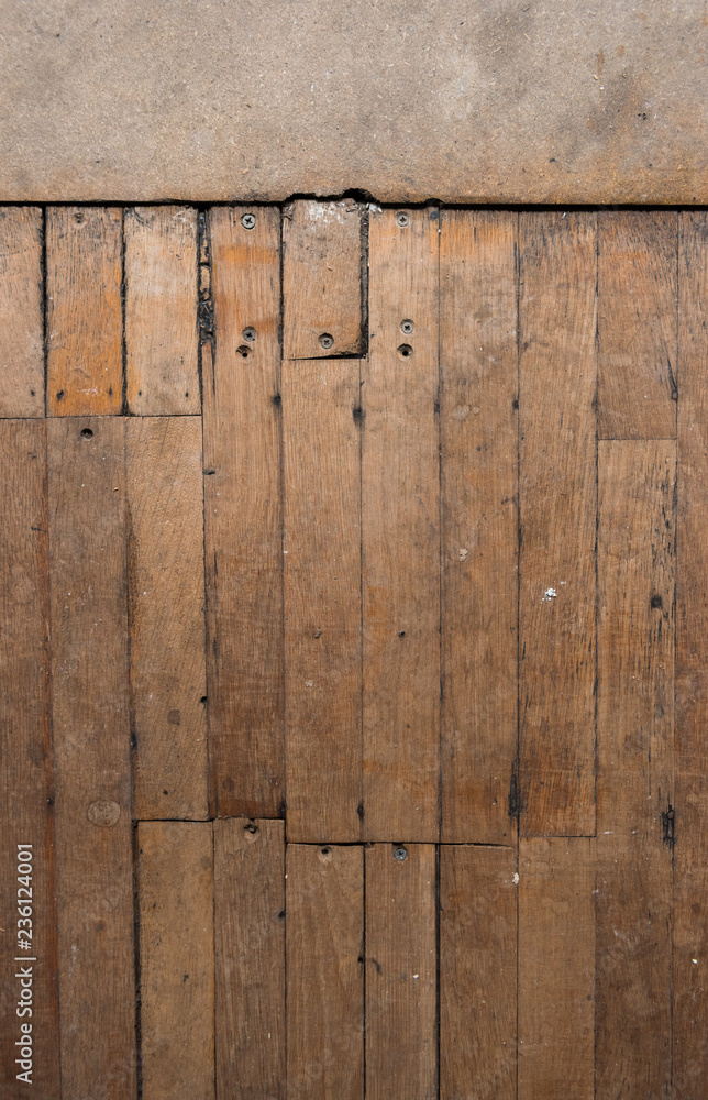 A vintage rustic antique wooden block flooring in an old abandoned