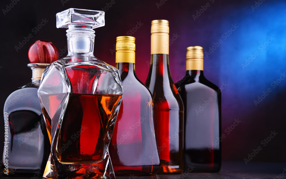 Carafe and bottles of assorted alcoholic beverages Carafe and bottles of assorted alcoholic beverages