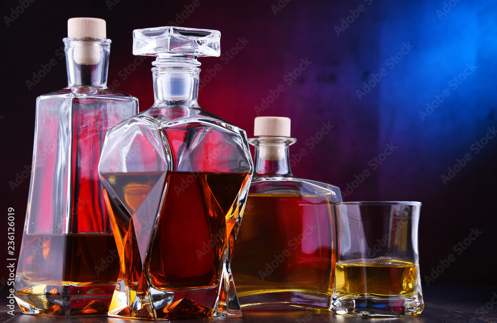 Carafe and bottles of assorted alcoholic beverages Carafe and bottles of assorted alcoholic beverages