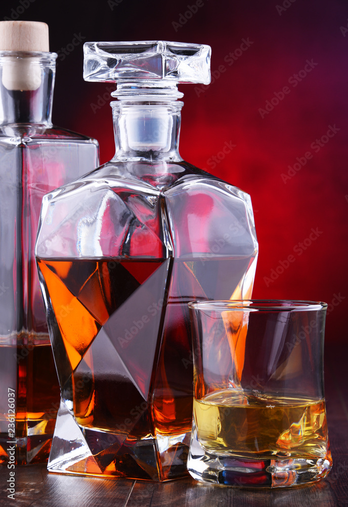 Carafe and bottles of assorted alcoholic beverages Carafe and bottles of assorted alcoholic beverages