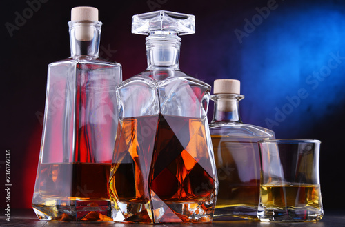 Carafe and bottles of assorted alcoholic beverages