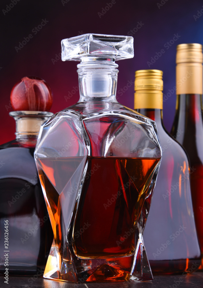 Carafe and bottles of assorted alcoholic beverages Carafe and bottles of assorted alcoholic beverages