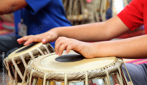 Kids playing Tabla. The tabla is a percussion instrument used in the Hindustani classical music