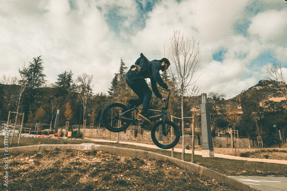Fototapeta premium BMX rider making tricks .Guy riding a bmx bike
