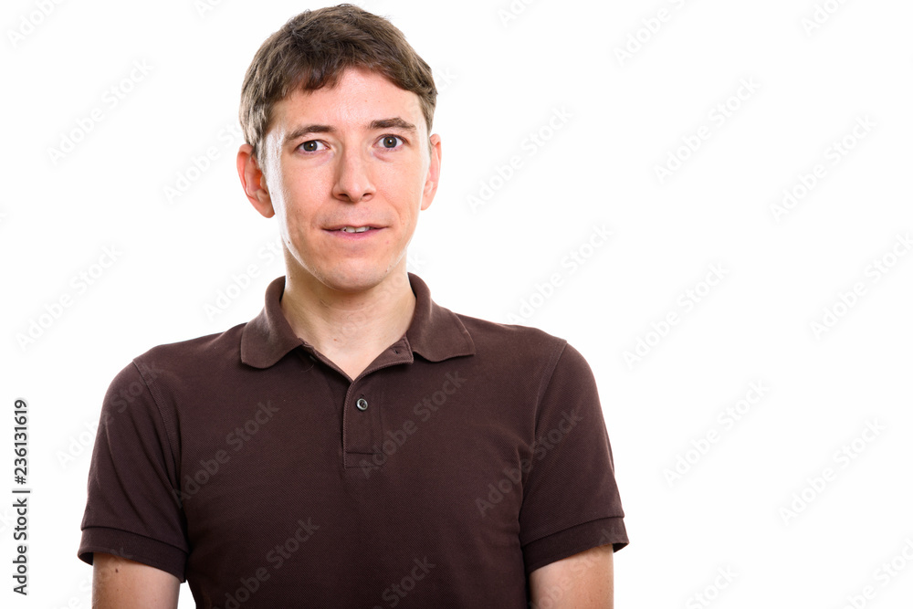 Studio shot of man standing and looking at camera Studio shot of man standing and looking at camera