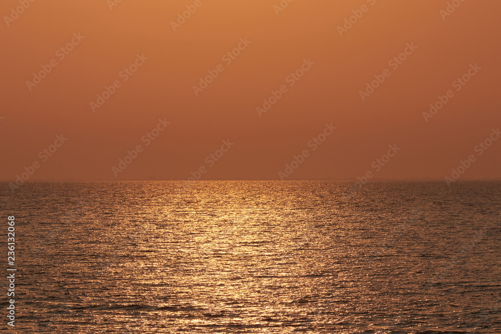 Sea in the rays of the rising sun - Beautiful golden water color
