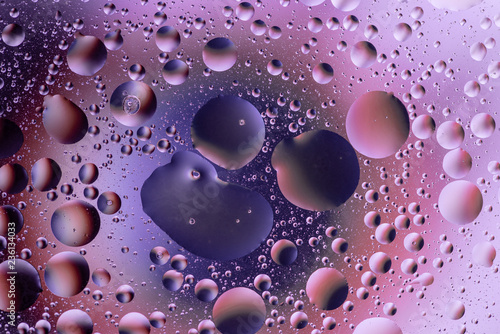 water drops on glass with colorful background  close-up 
