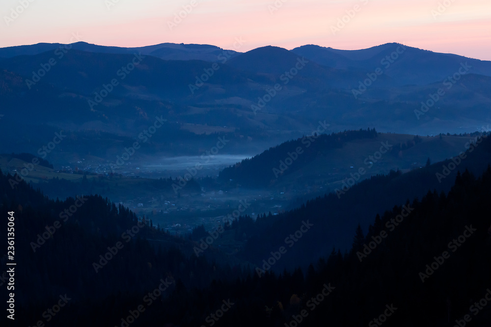 Fantastic view on the mountain forest in autumn - sunset in the Carpathians Fantastic view on the mountain forest in autumn - sunset in the Carpathians