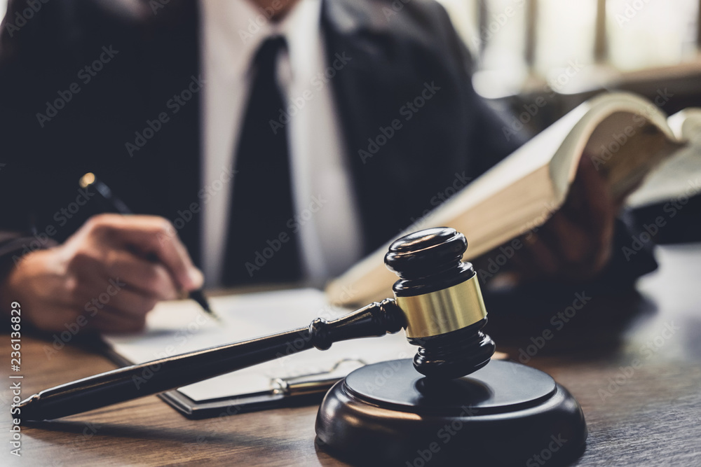 Judge gavel with Justice lawyers, Lawyer or Judge counselor working with agreement contract in Courtroom, Justice and Law concept Judge gavel with Justice lawyers, Lawyer or Judge counselor working with agreement contract in Courtroom, Justice and Law concept