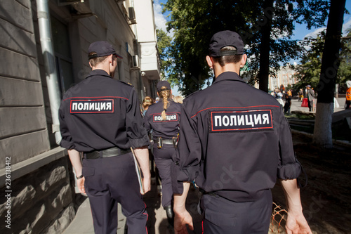 Russian policeman in uniform with the inscription