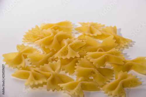 Macaroni bows on white background near