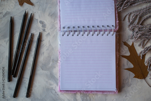 Vintage background with blank paper and pencils.
