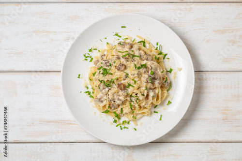 Spaghetti with mushrooms in cream sauce. Copy space for your text.