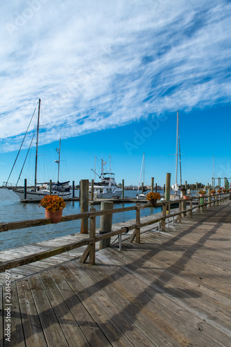 Boats on the water, blue sky above, scenes from historic waterfront Beaufort North Carolina