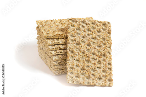 Φωτογραφία One main crispbread against the background of stack of crispbread with sesame is
