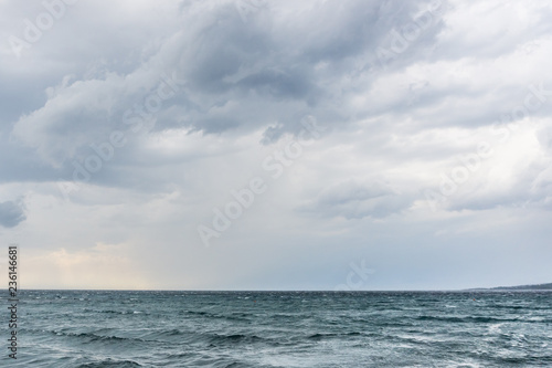 Sea water waves on cloudy day, nature background . Ocean view on cloudy summer day