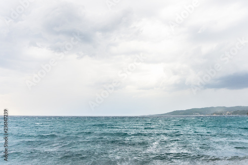 Sea water waves on cloudy day, nature background . Ocean view on cloudy summer day © Zoran