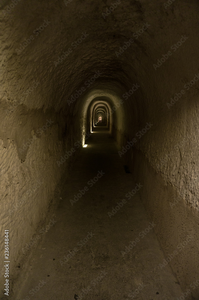 Dark tunnel with light in background
