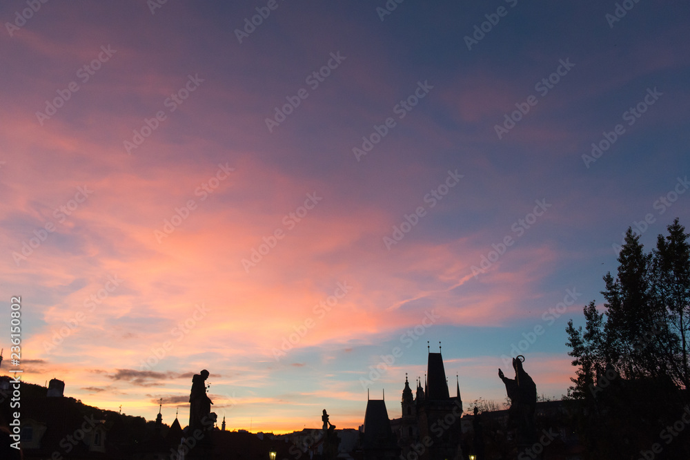 Statues on Charles bridge in Prague at sunset Statues on Charles bridge in Prague at sunset