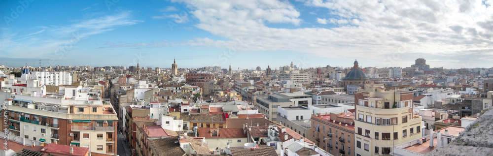A landscape of Valencia as seen from the Torres de Serrans (Serranos Gate) during a sunny winter day with blue sky and clouds, Spain