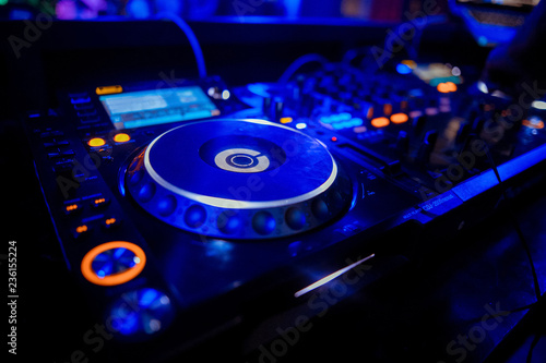 Dj playing the track in the nightclub at party closeup