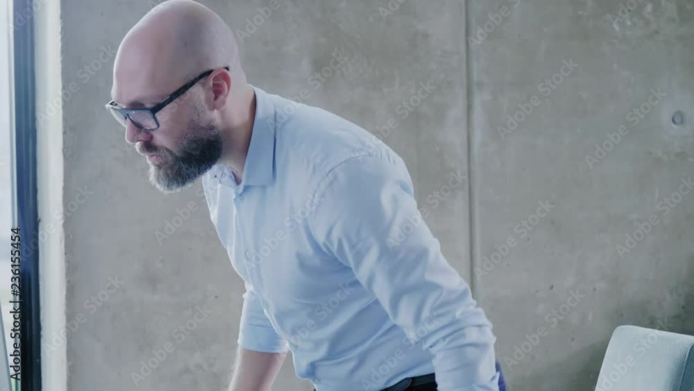 Middle-aged designer working in office Middle-aged designer working in office
