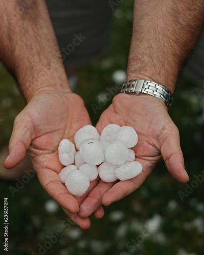 Hail in hands after hailstorm in Aurora, Colorado