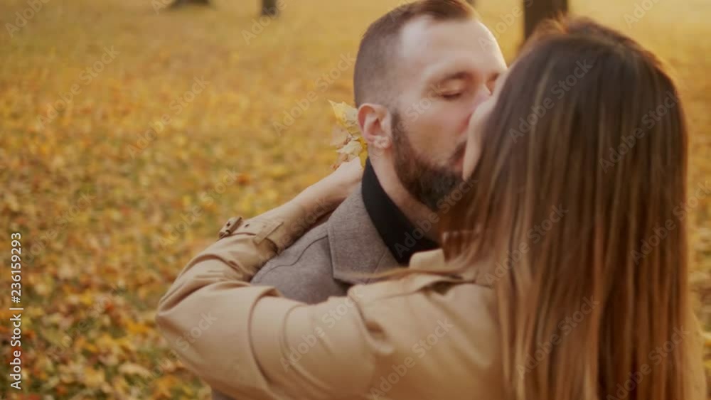 Close up of beautiful young couple kissing in forest Close up of beautiful young couple kissing in forest