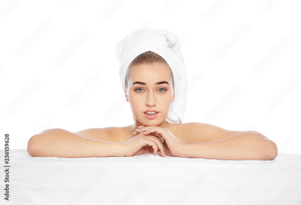 Portrait of young pretty woman with towel on white background Portrait of young pretty woman with towel on white background