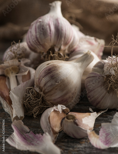 Close-up natural organic vegetable garlic on a wooden background with place for text.