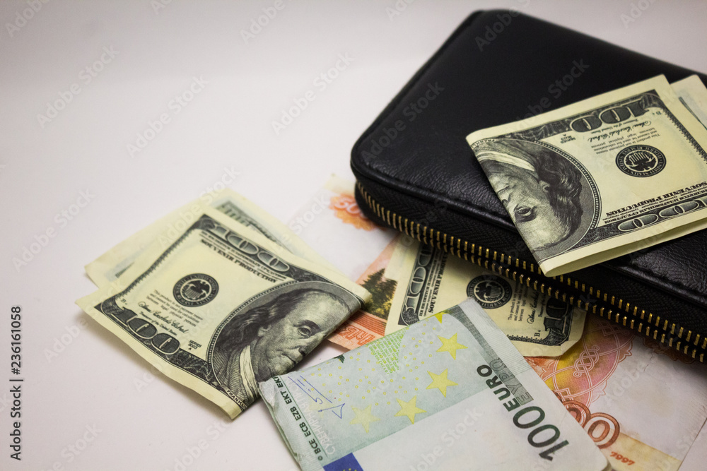 Dollar and euro notes on a white background Dollar and euro notes on a white background