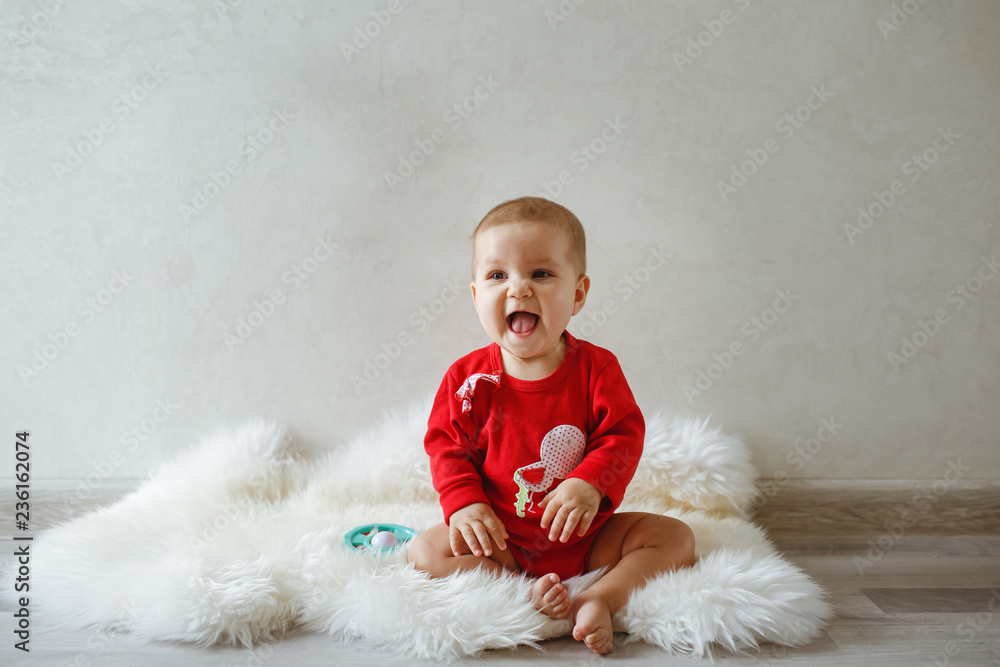 A little girl at the photo shoot, dressed in red coat. A little girl at the photo shoot, dressed in red coat.