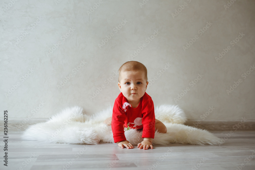 A little girl at the photo shoot, dressed in red coat. A little girl at the photo shoot, dressed in red coat.