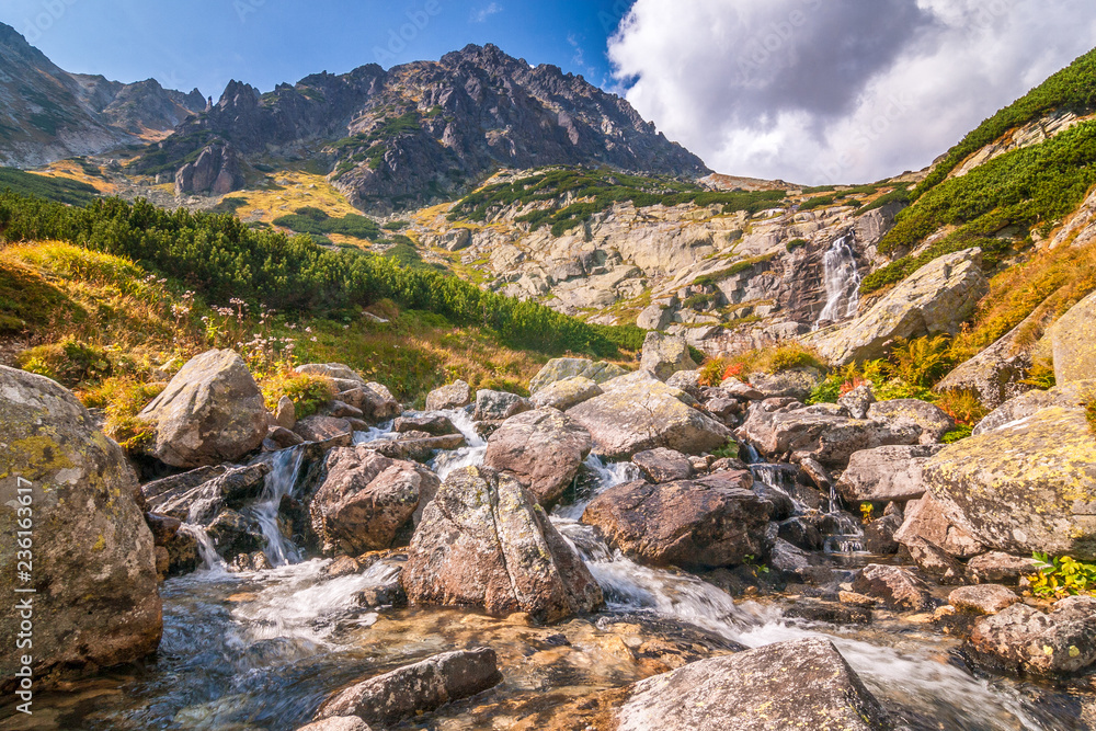 Mountain landscape with waterfall on a stream, Mlynicka valley in High Tatras National Park, Slovakia, Europe. Mountain landscape with waterfall on a stream, Mlynicka valley in High Tatras National Park, Slovakia, Europe.