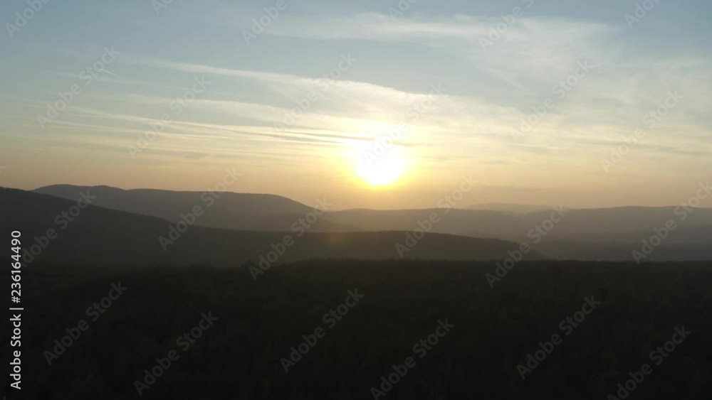 Aerial Sunset in mountains. Drone view on mountains in golden and blue hour Aerial Sunset in mountains. Drone view on mountains in golden and blue hour