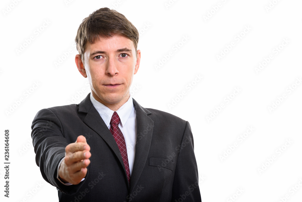 Studio shot of businessman giving handshake for agreement Studio shot of businessman giving handshake for agreement
