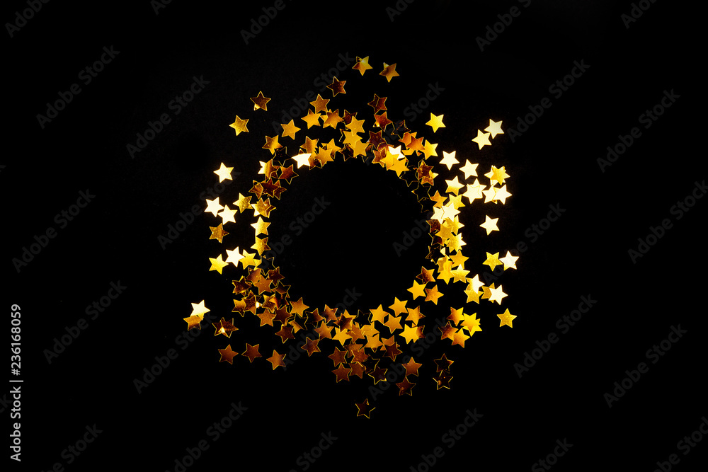 Beautiful christmas golden silver deco baubles on dark black background. Flat lay design. Copy Space. Horizontal.