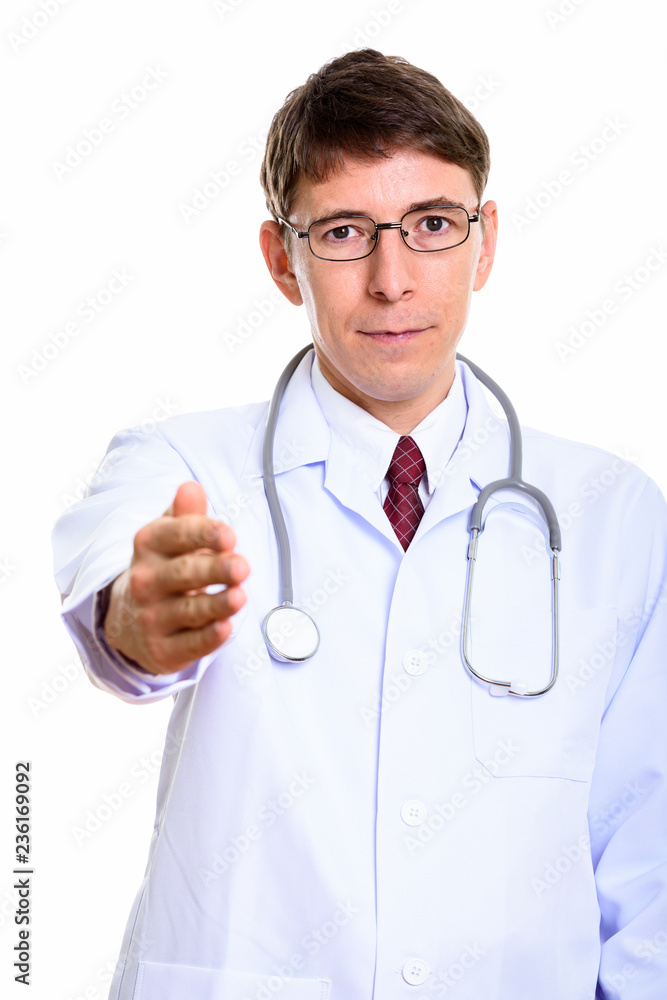 Studio shot of man doctor giving handshake Studio shot of man doctor giving handshake