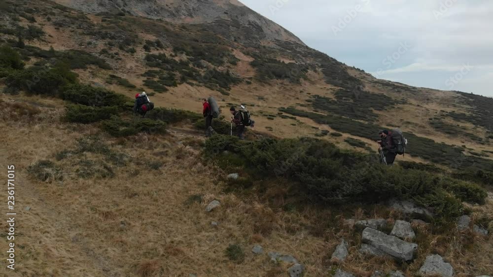 Aerial shot tourists go on mountains Aerial shot tourists go on mountains