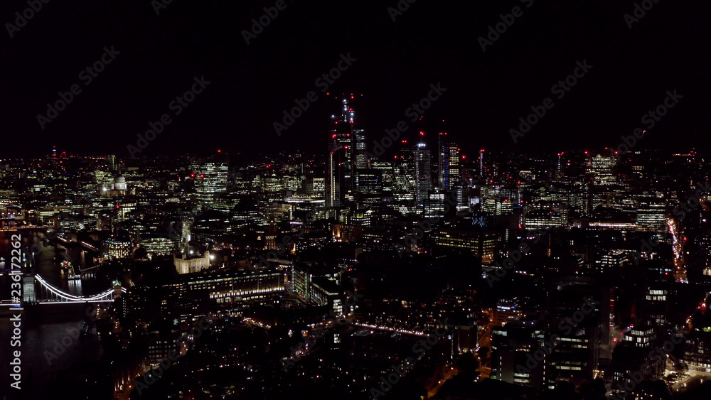 Aerial London City View feat. New Modern Office and Business Buildings Lights in the Financial District at Night