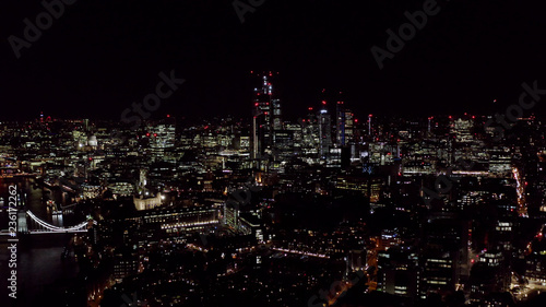Aerial London City View feat. New Modern Office and Business Buildings Lights in the Financial District at Night