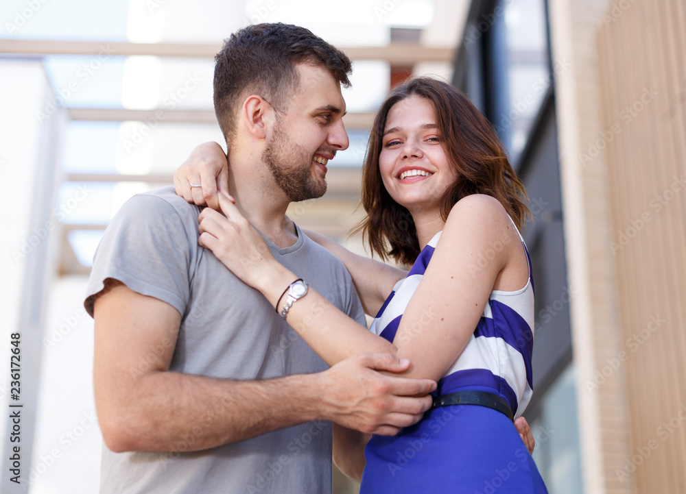 Fototapeta premium Happy man and girl standing and hugging