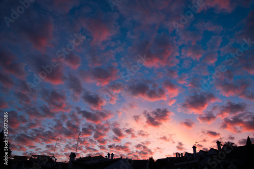 urban silhouette and dramatic skies with cirrocumulus clouds at dusk, © imago1956rs