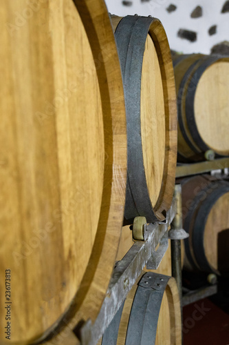 Close-up of Wooden Barrels in oak Stored At Wine Cellar