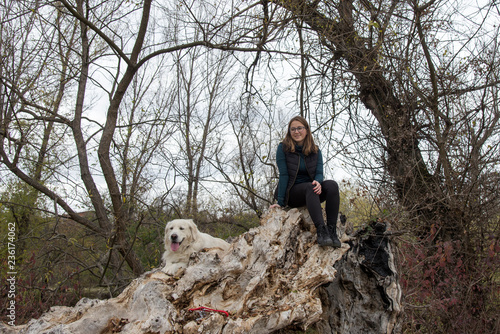 Woman and dog enjoying in the nature photo